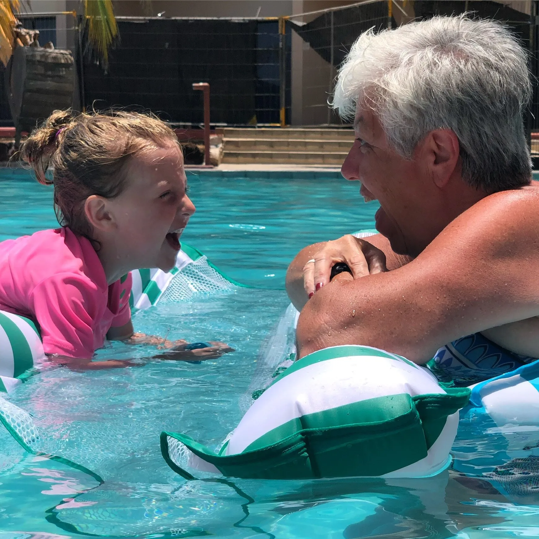 A family enjoying the pool at a family-friendly all-inclusive resort