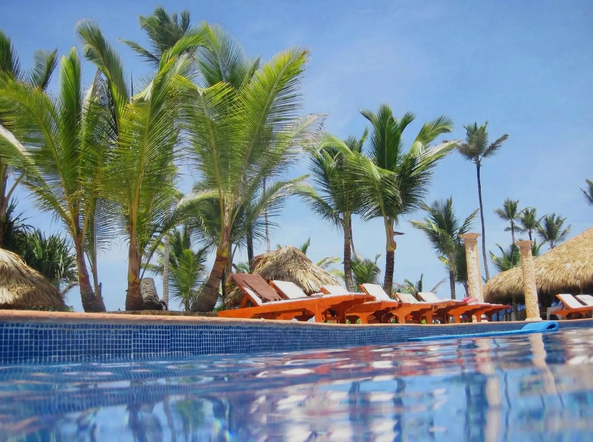 Poolside lounge chairs at Caribbean resort